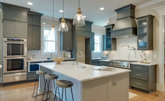 Designer kitchen with slate-grey cabinets and marble island