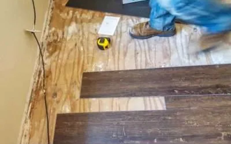 Construction Worker Installing a New Floor