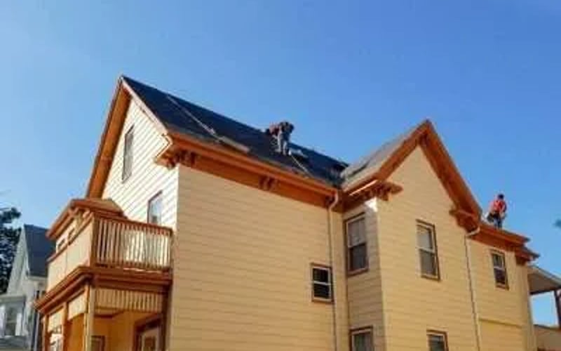 Workers on a Roof