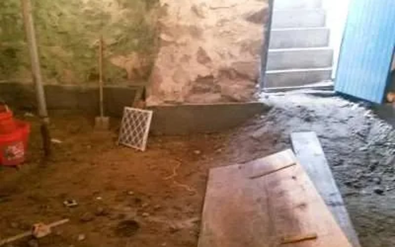 Basement entry before — dirt floor